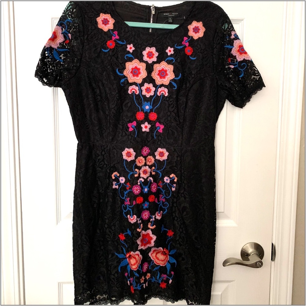 Elegant Lace dress w/ vibrant embroidery on front & shoulders.